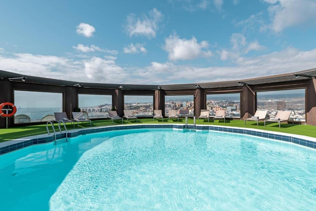 Room with balcony and ocean/city views